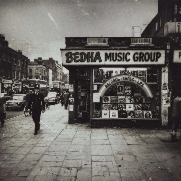 A vintage record store front featuring the BEDHA Music Group sign.&amp;#34;